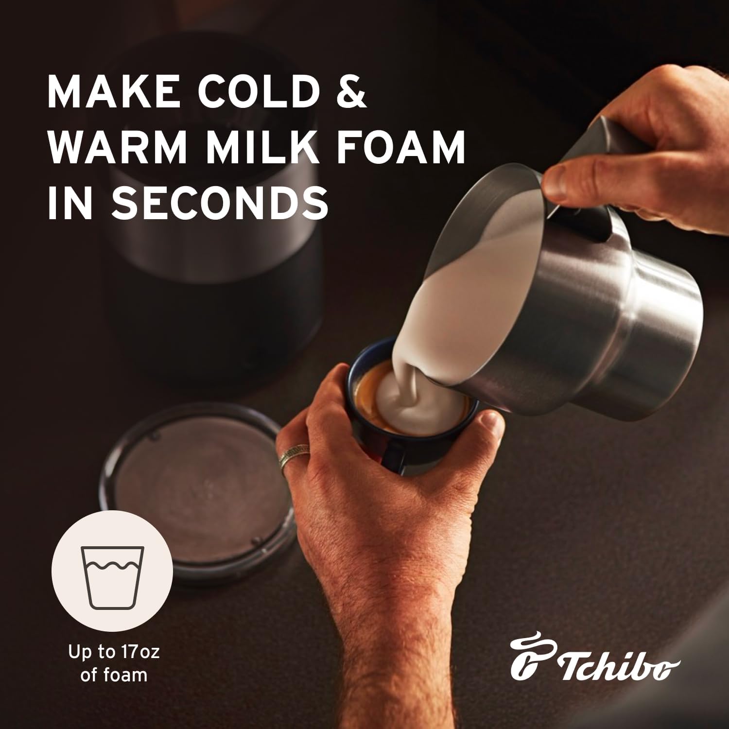 Hands pouring frothed milk from the Tchibo Induction Milk Frother