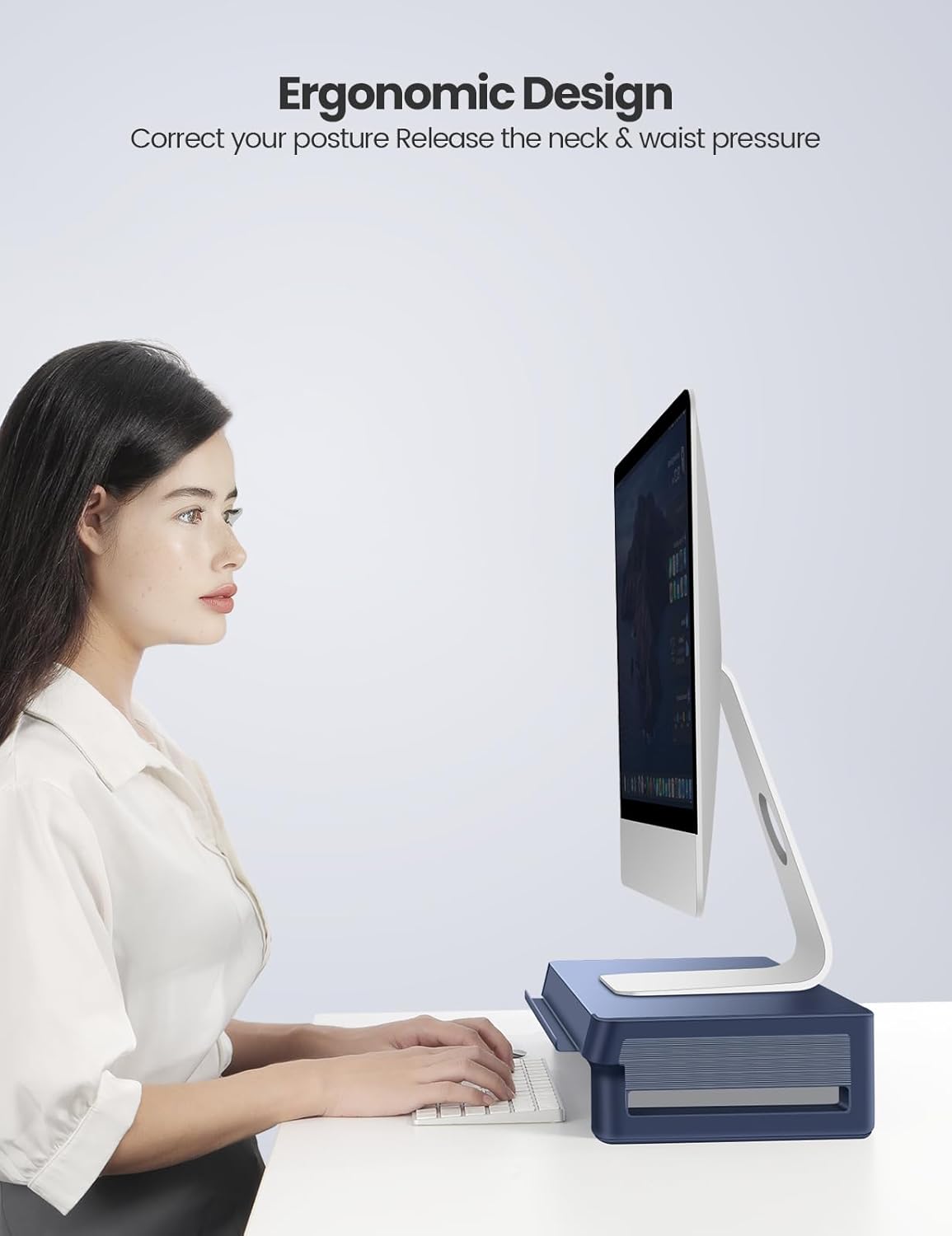 Person sitting at a desk with a monitor on the Vaydeer stand, demonstrating ergonomic posture