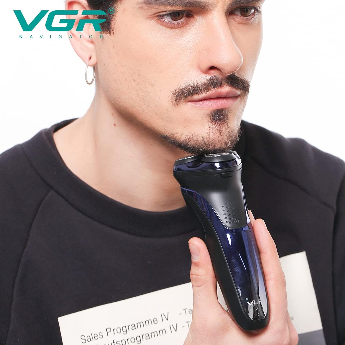 VGR V-306 Electric Shaver being rinsed under a faucet, demonstrating its full washability for easy cleaning.