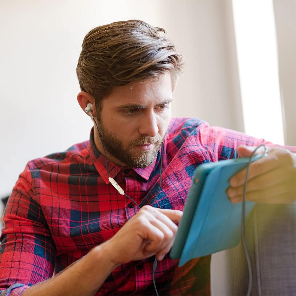 Man using Bitmore Aural AUX wired headphones with a tablet