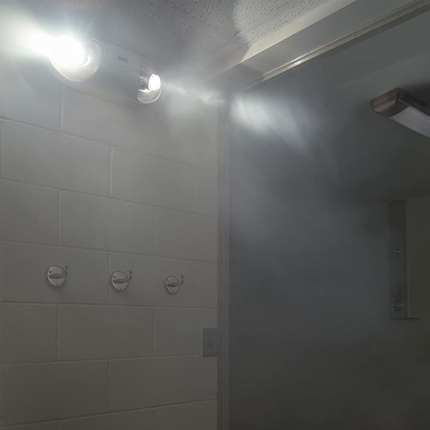 Philips LED Emergency Luminaire mounted on a wall, illuminating a hallway