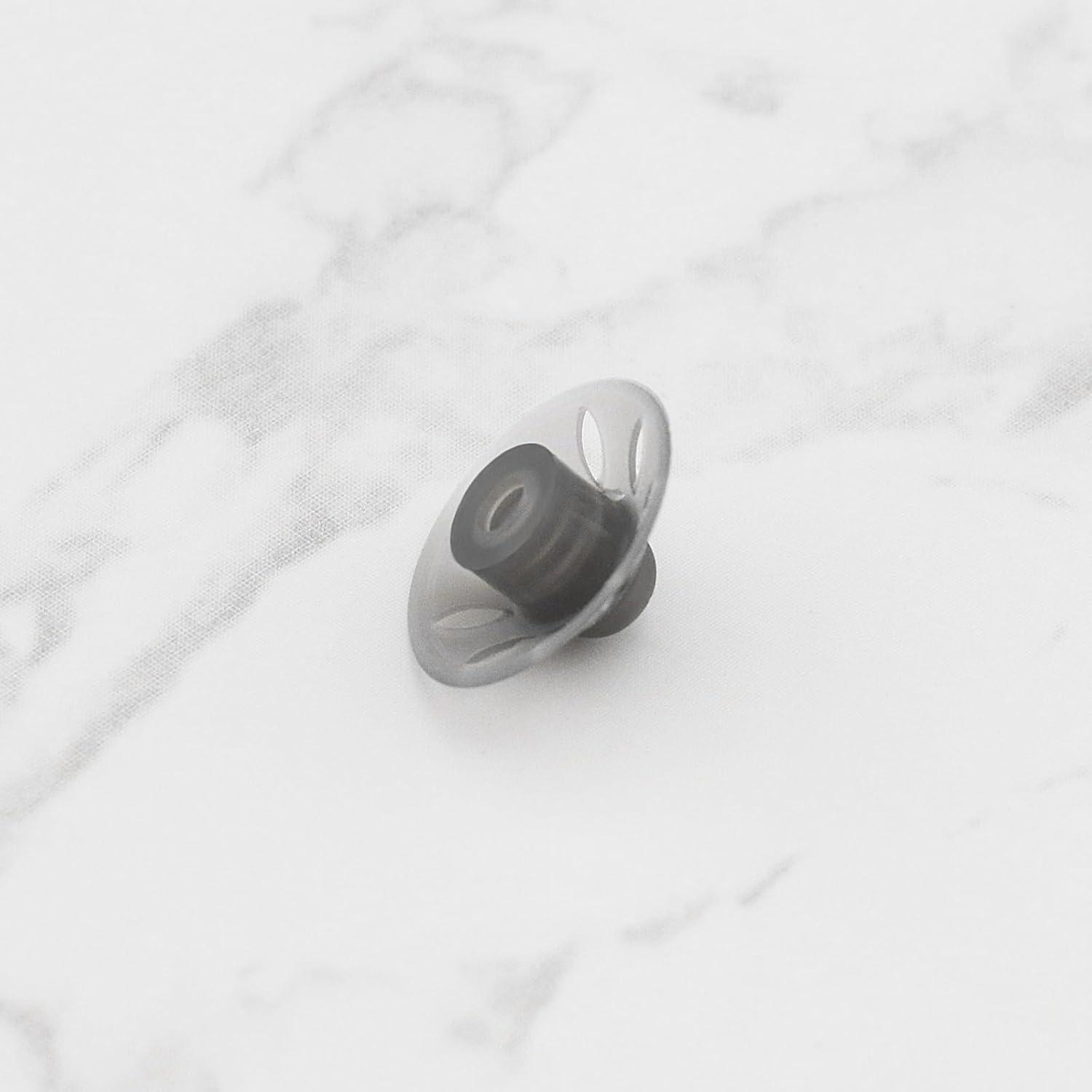 Close-up view of multiple eMagTech silicone hearing aid domes