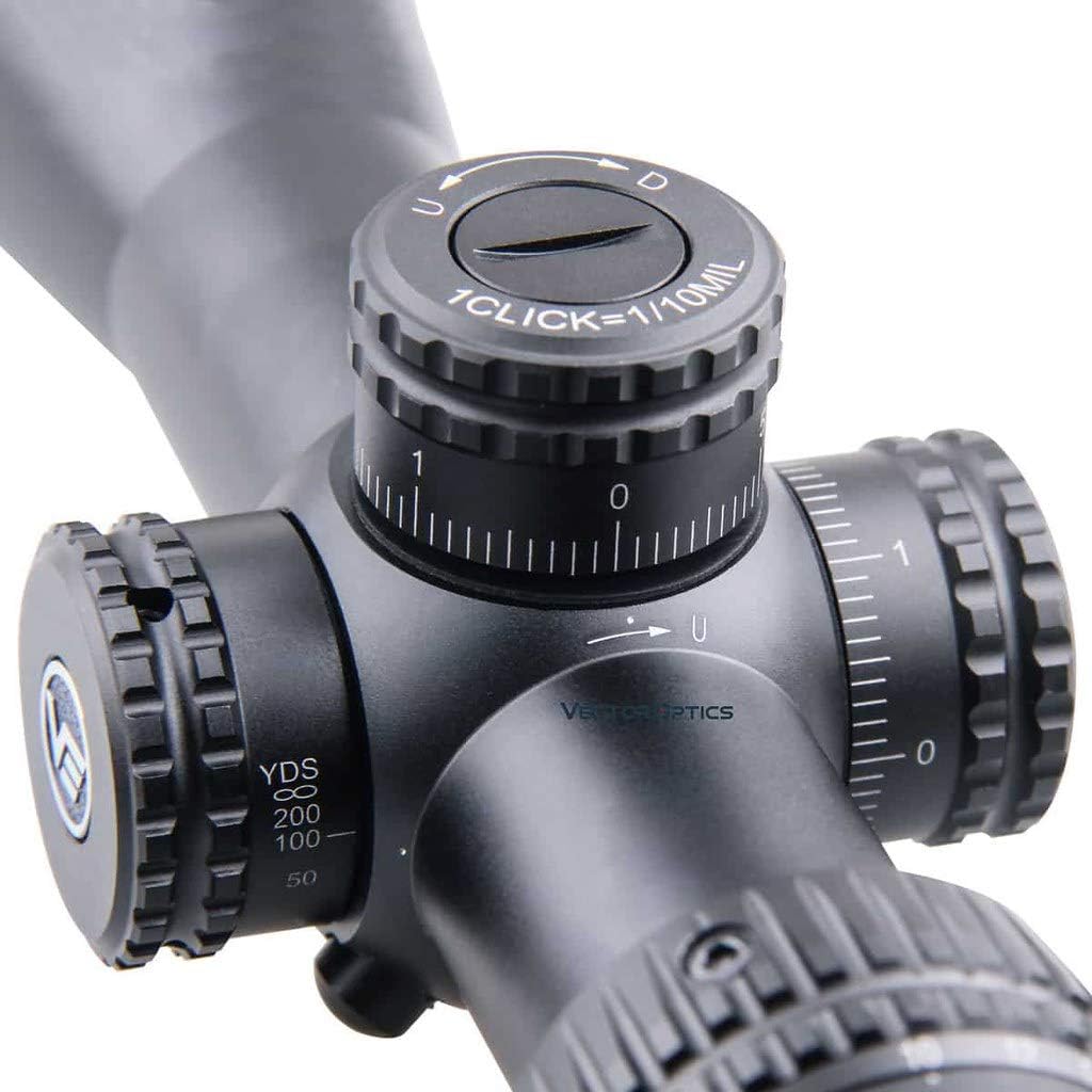 Close-up of the elevation and windage turrets on the Vector Optics Veyron riflescope, showing click adjustments and locking mechanism