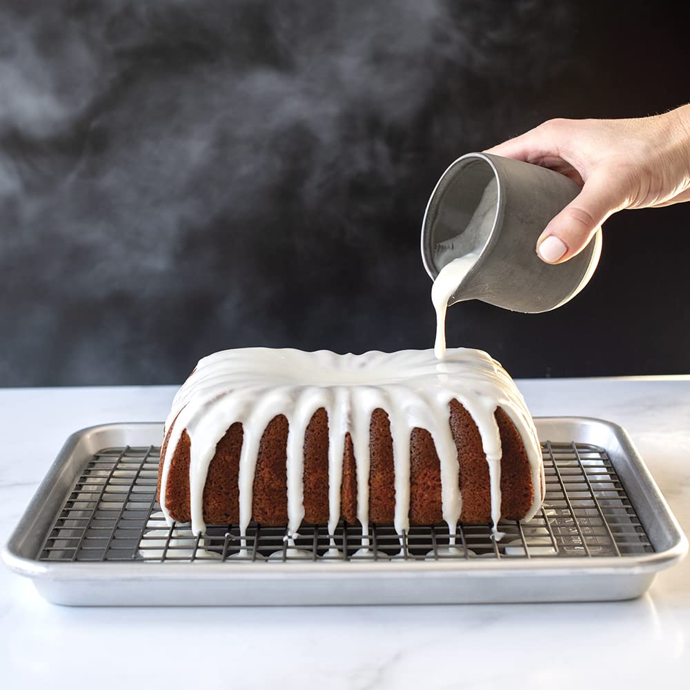 Cake being glazed on Nordic Ware nonstick grid