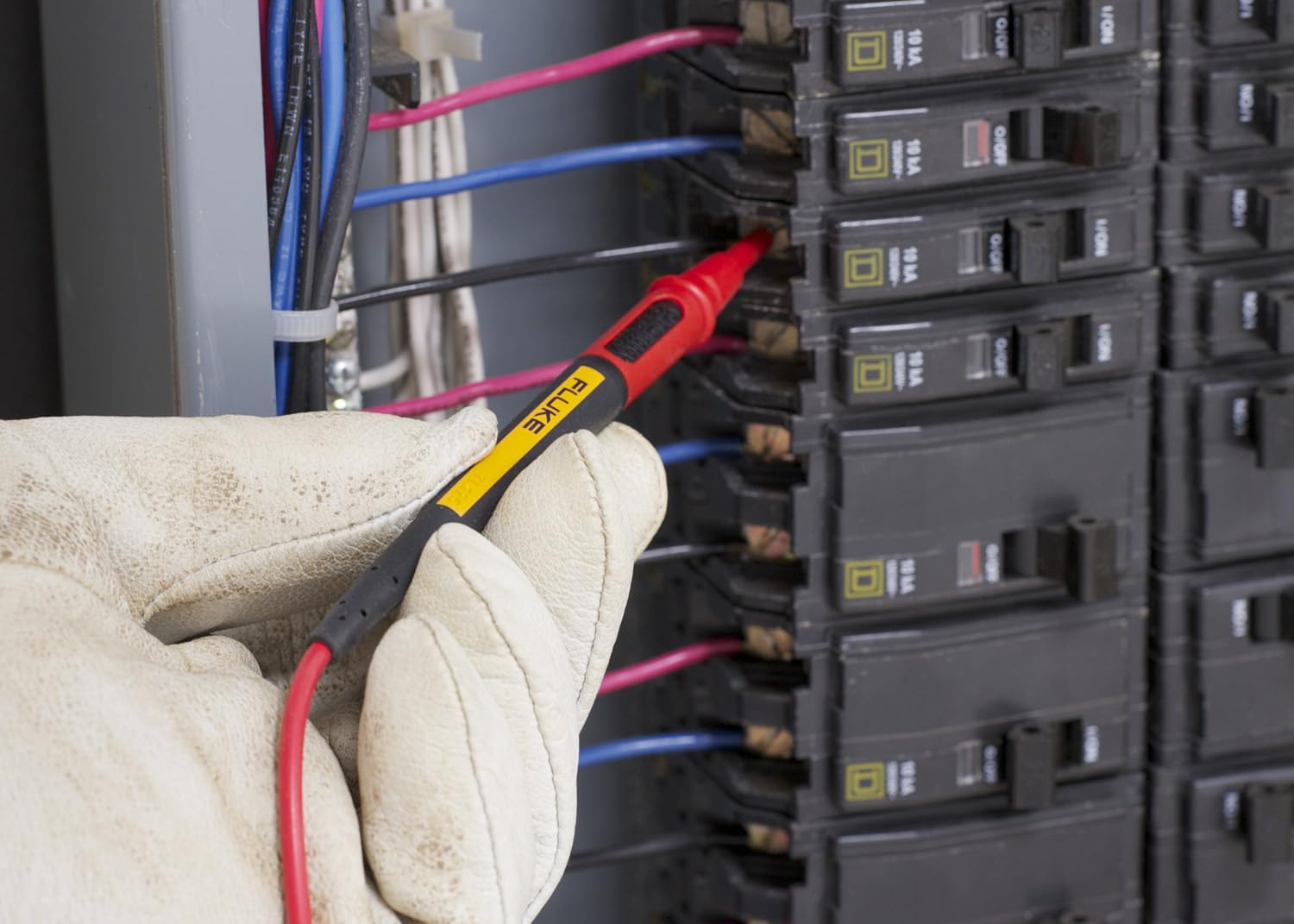 Fluke TL175 Test Lead being used to measure in a circuit breaker panel