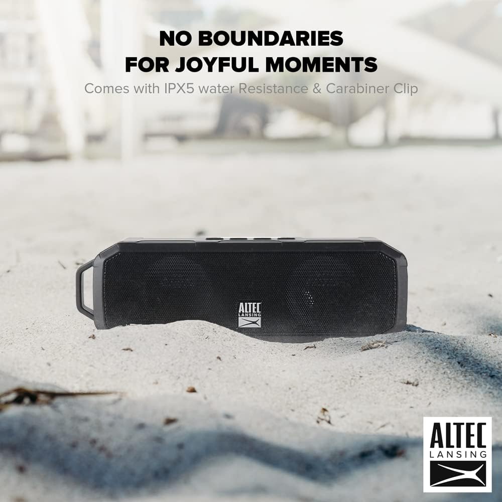 Altec Lansing Fury Wireless Speaker on sand, highlighting IPX5 water resistance and carabiner clip.