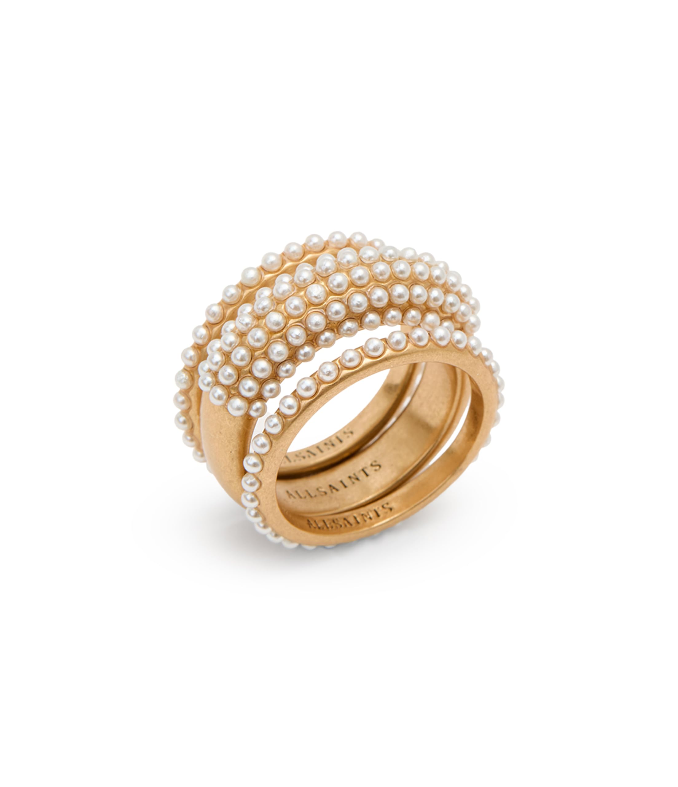 Conjunto de tres anillos con perlas de AllSaints. Joyas apilables con delicadas perlas artificiales. Accesorios modernos para mujer, en latón dorado