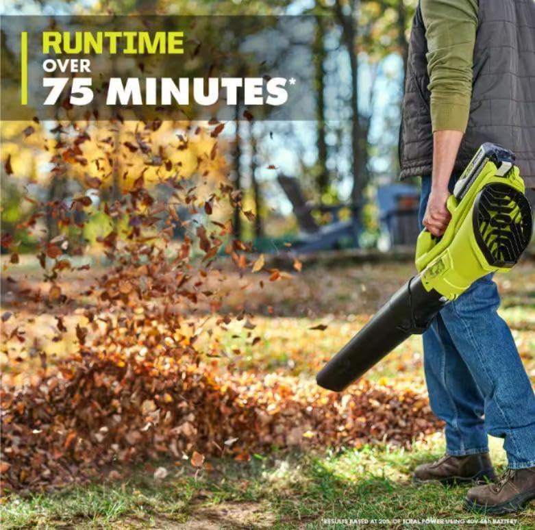 Man operating CUSHYBITE 40V Cordless Blower clearing leaves