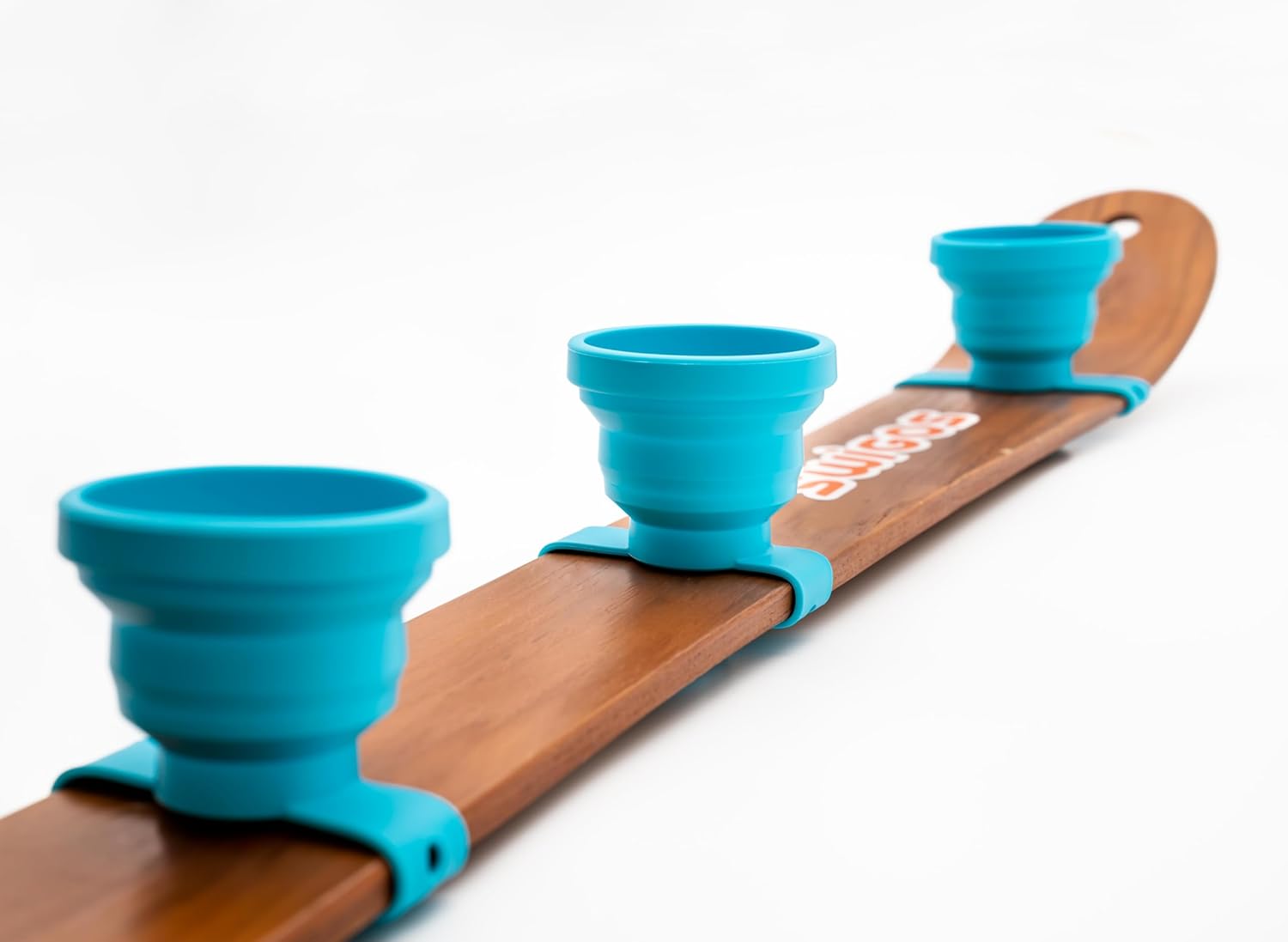 Collapsible and Portable Shot Ski Kit - 4-pack w/ carrying pack. Silicone cups with an adjustable strap that turn any object into a "shot ski"