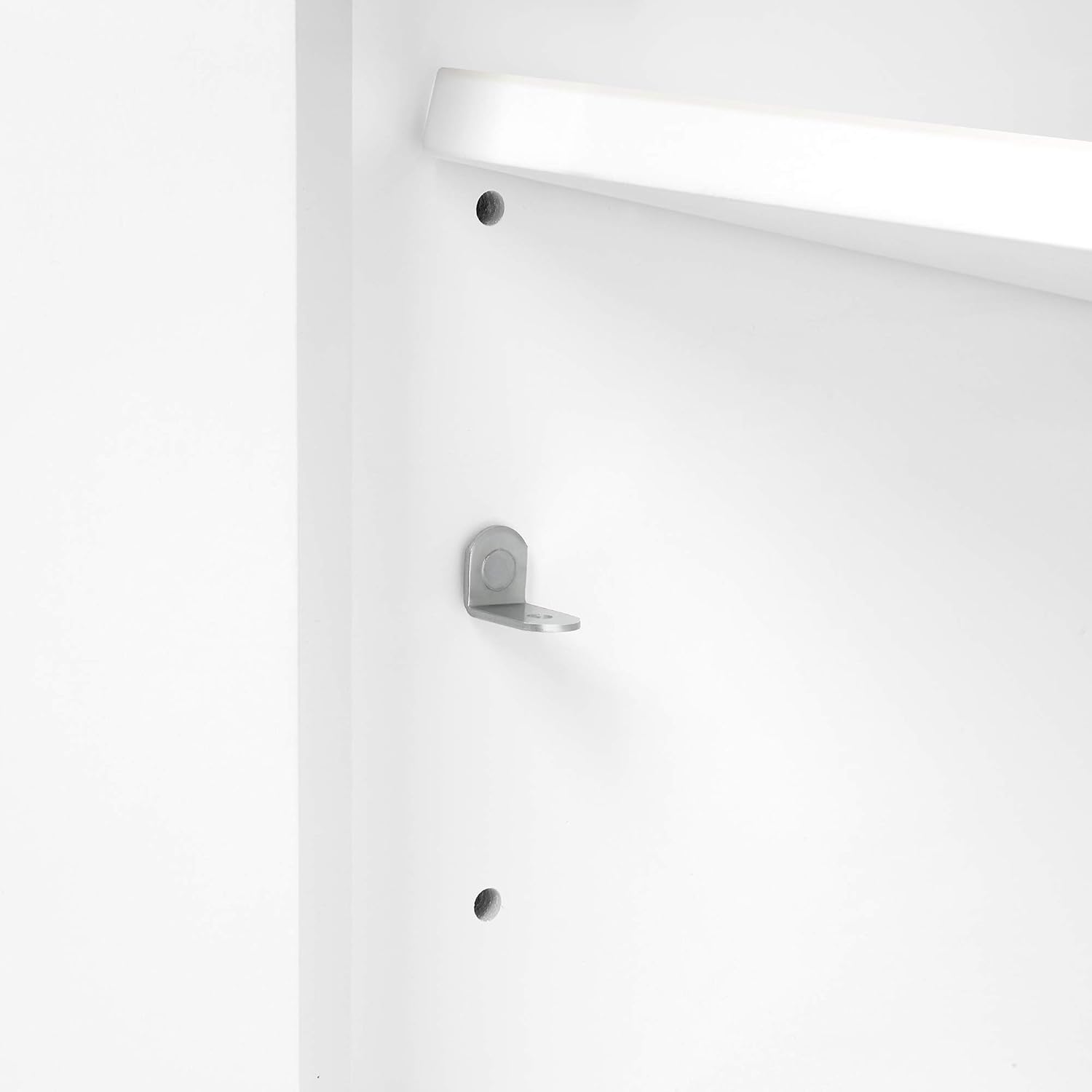 Close-up of a soft-close hinge on a vanity door.