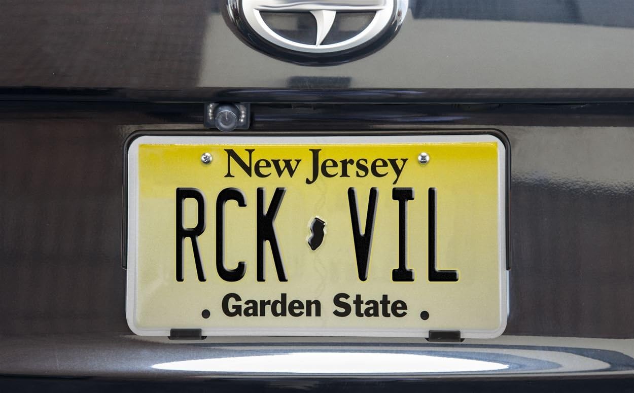 Backup camera discreetly installed above a vehicle's license plate