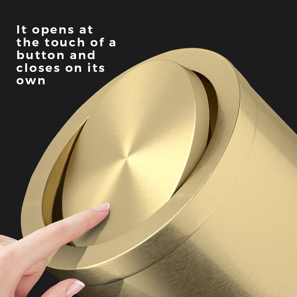 Close-up image of a hand pressing the center of the trash can lid, demonstrating how it opens and closes on its own with a touch.