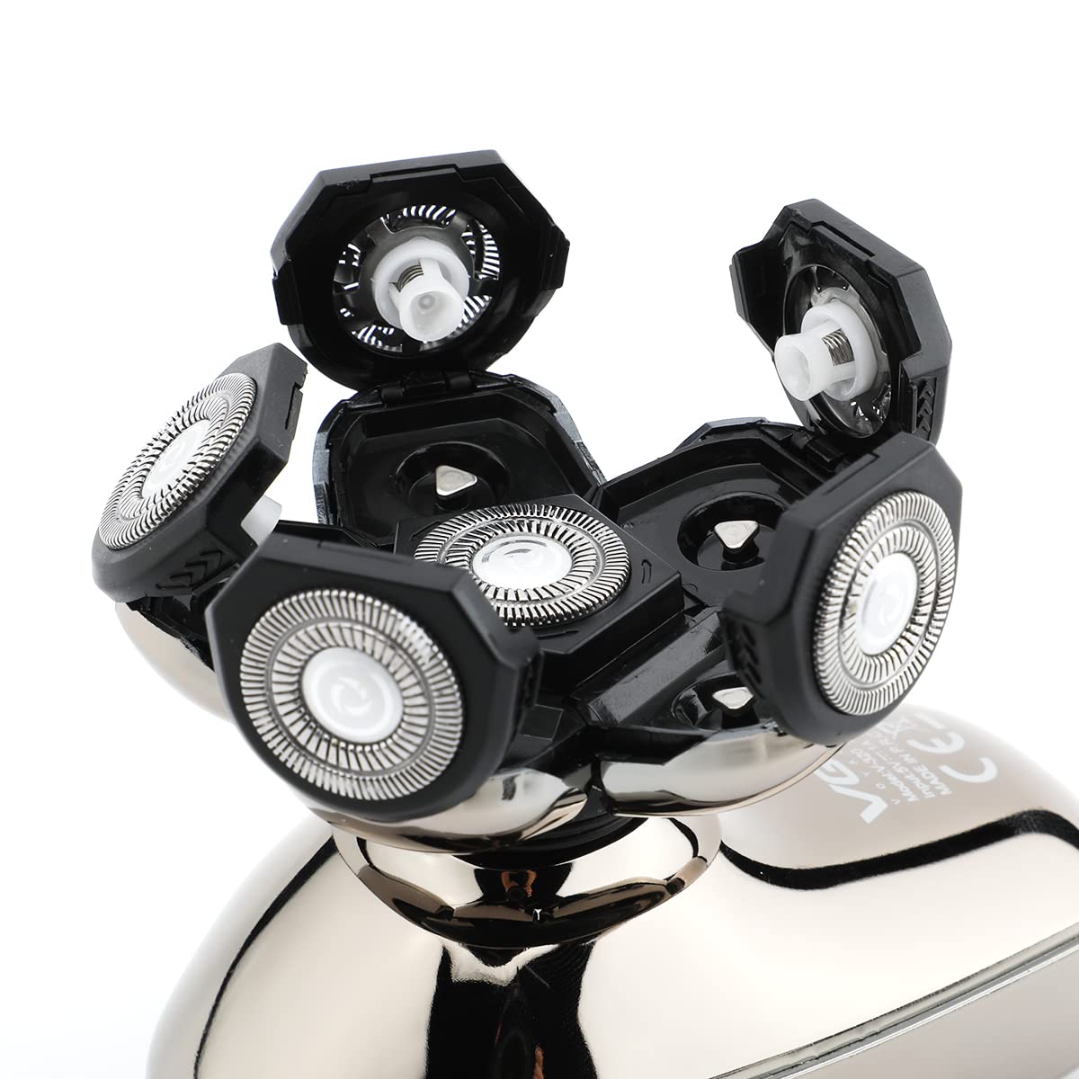 Close-up view of the VGR V-320's electric shaver head with its individual floating rotary blades open for cleaning.