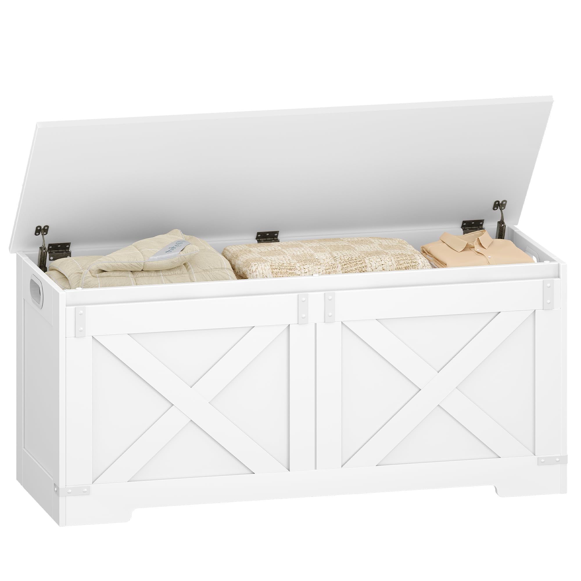 White storage chest with its lid open, revealing neatly folded blankets and clothes inside, placed at the foot of a bed.