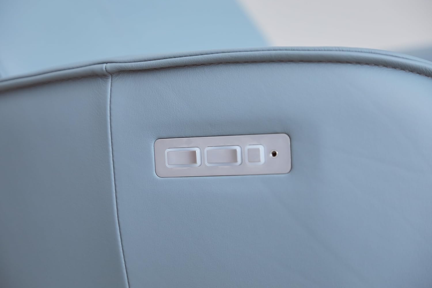 Close-up of the control buttons on the side of the Fjords Axel Recliner Chair