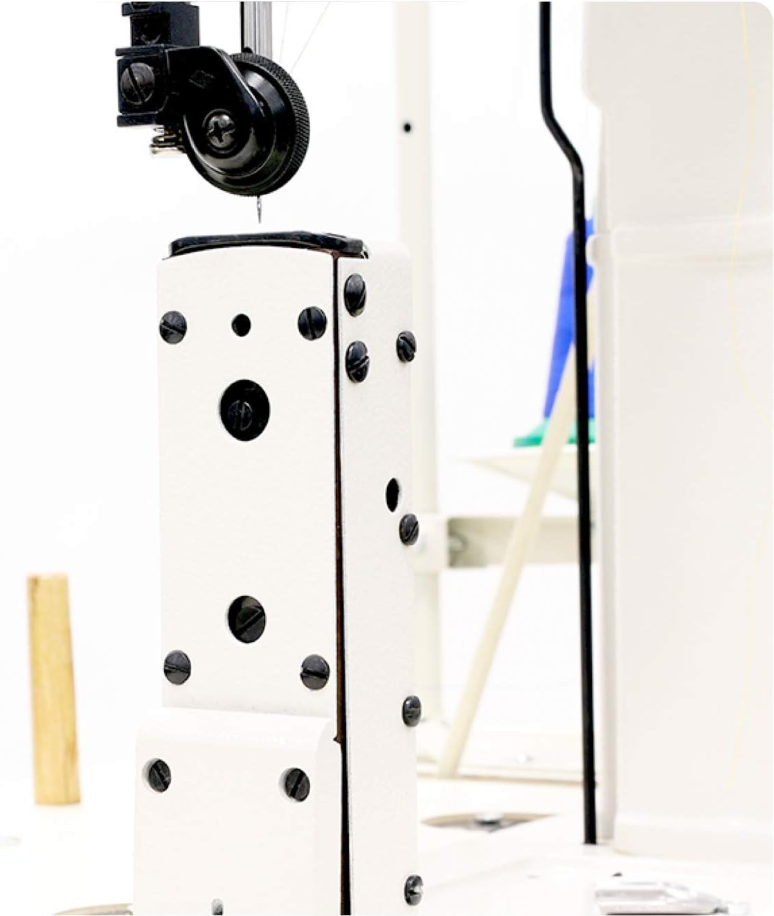 Side view of the iKonix KS-810 post-bed sewing machine head, showing the needle area, presser foot, and the elevated post bed design. A thread is visible near the needle.