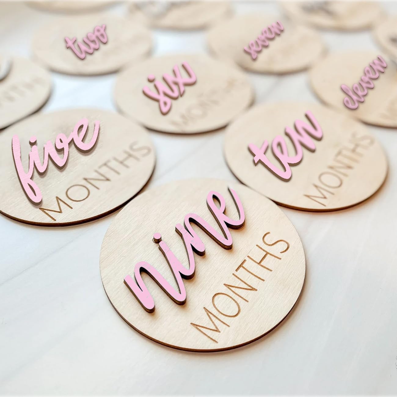 Photo 1 of ***MISSING 2 PIECES*** eoscasely Baby Monthly Milestone Markers Disc, Wooden 3D Milestone Cards for Photos, Baby Announcement Sign, 1-12 Months, wooden baby milestone sign (Pink)