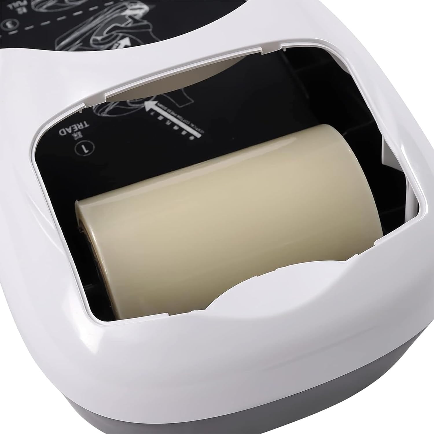 Close-up of shoe film roll being loaded into the machine