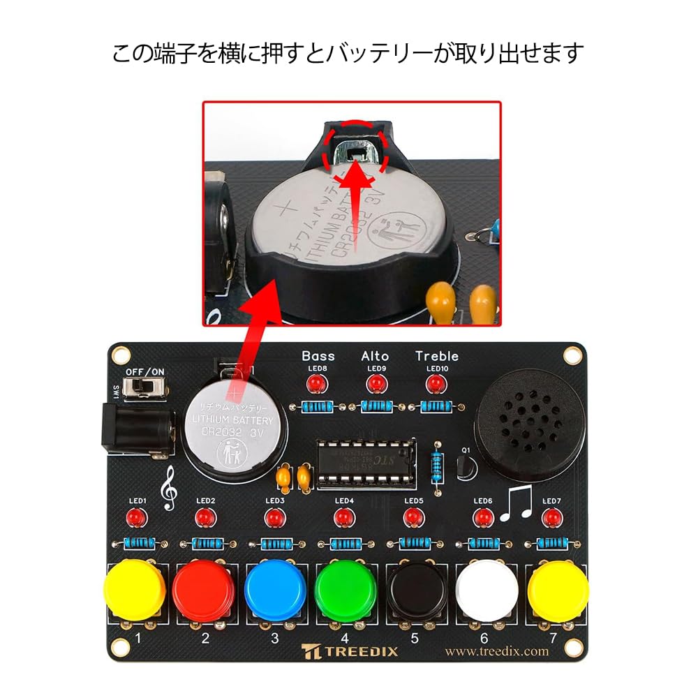 Close-up view of battery compartment on Treedix Soldering Practice Piano Kit, showing how to remove the battery.