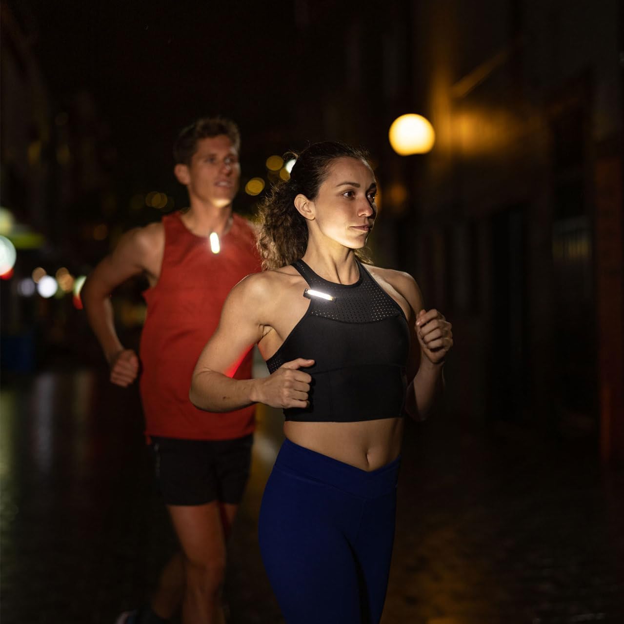 Knog Plus Free Light clipped onto clothing during nighttime activity.