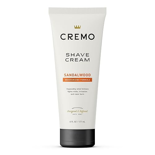 Cremo Crema de afeitar de sándalo de grado barbero, sorprendentemente superior, crema de afeitado ultrafina que combate los rasguños, cortes y