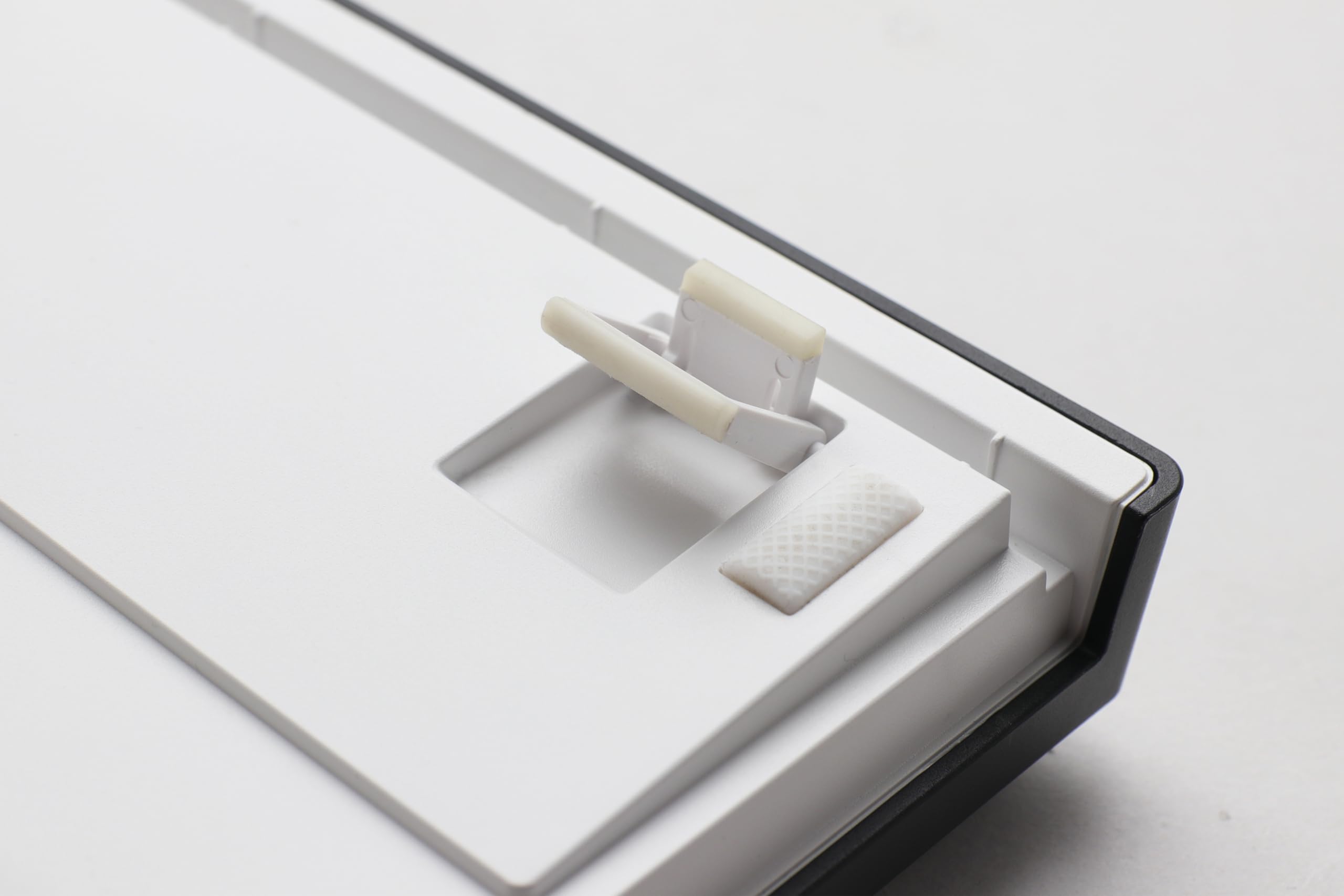 Hand using a switch puller to remove a mechanical switch from the Ducky Zero 6108 keyboard