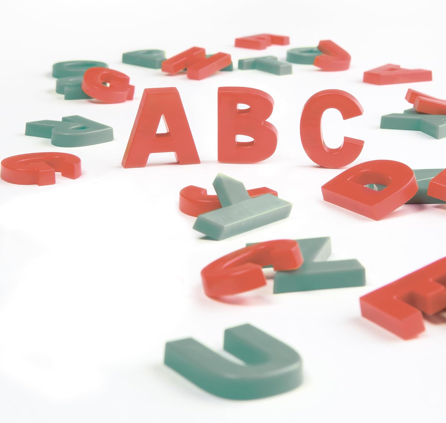 Magnetic letters 'ABC' on a white surface.
