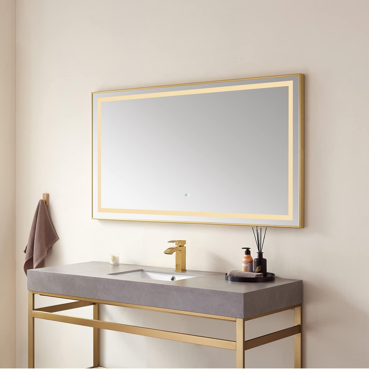 VINNOVA Teruel LED mirror installed above a bathroom vanity with a gold faucet.