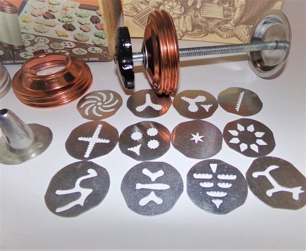 Close-up of various cookie discs for the Mirro Cookie Press