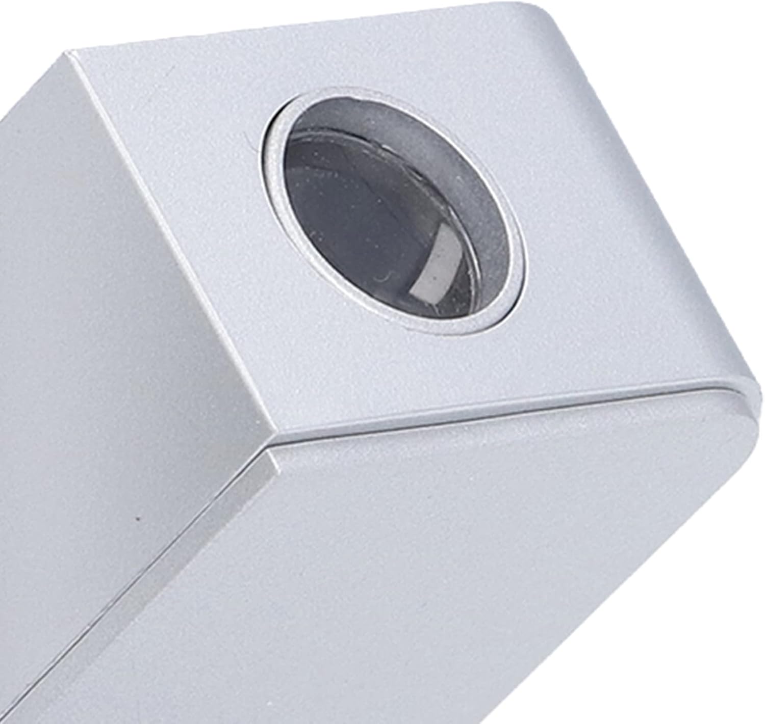 Close-up of the projection lens on the side of the alarm clock.