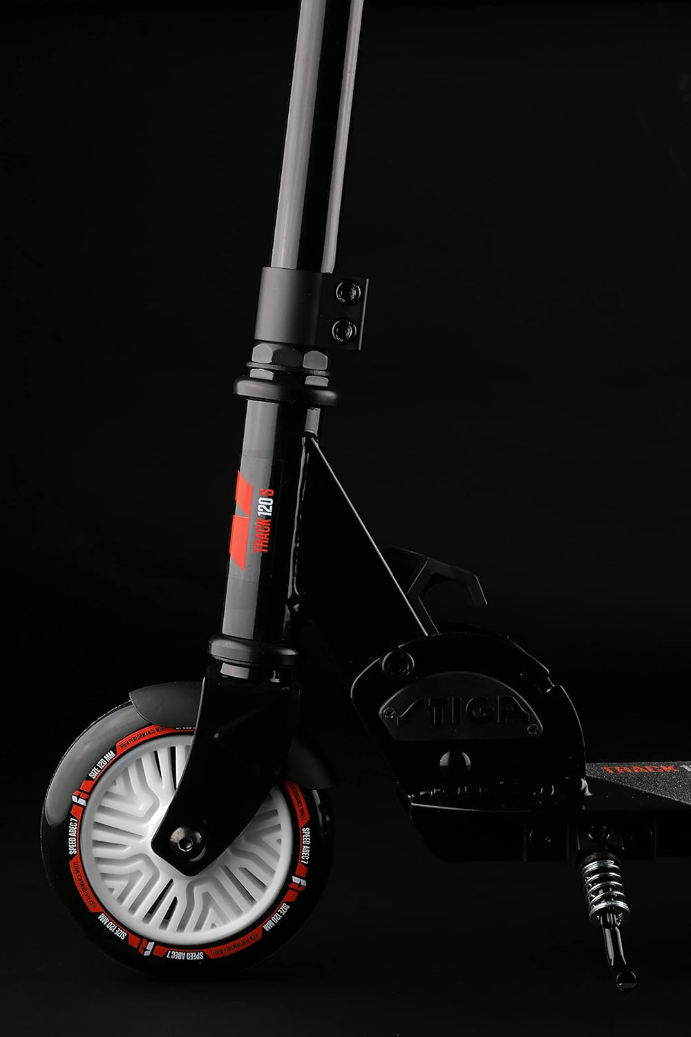 Close-up of STIGA Track 120 S front wheel and handlebar base