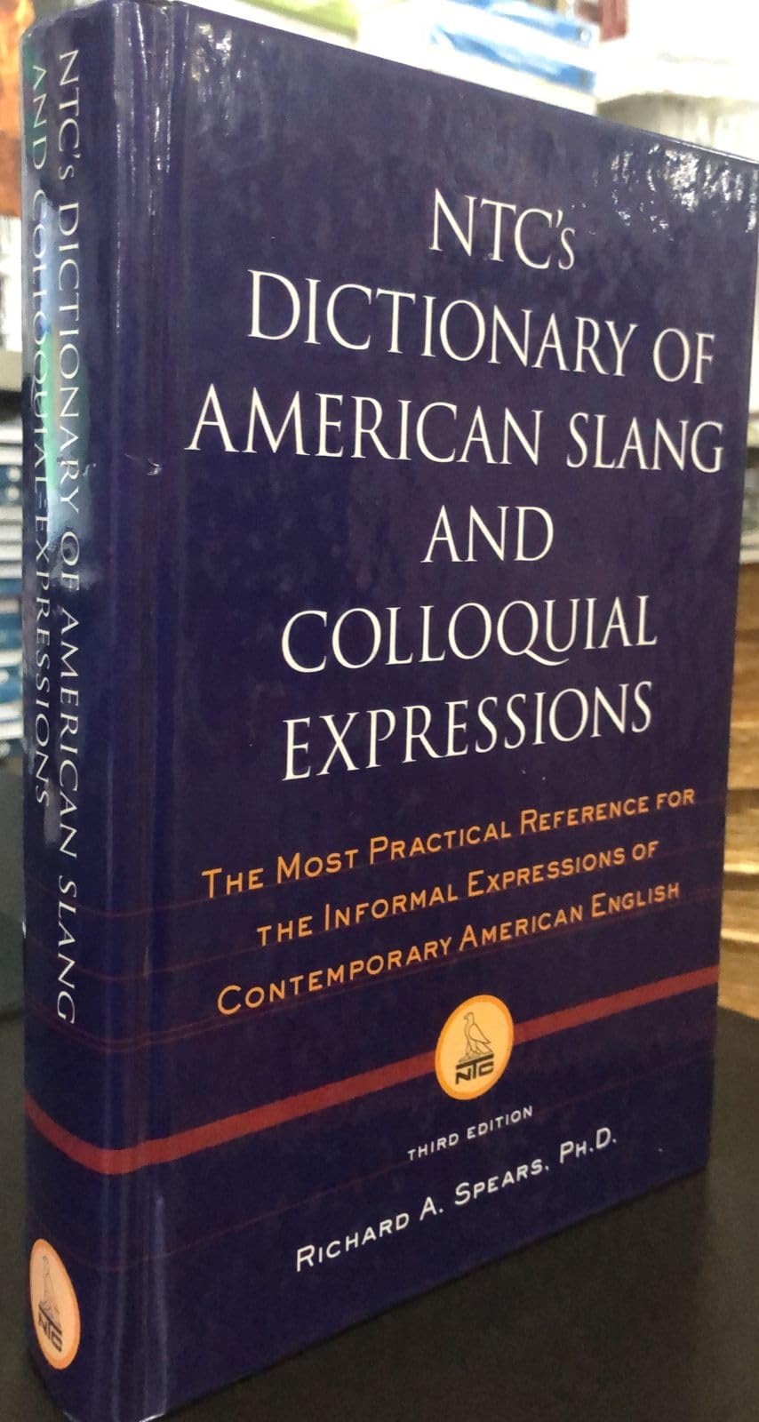 Buy NTC's Dictionary of American Slang and Coloquial Expressions (National Textbook Language Dictionaries) — BookShops.in