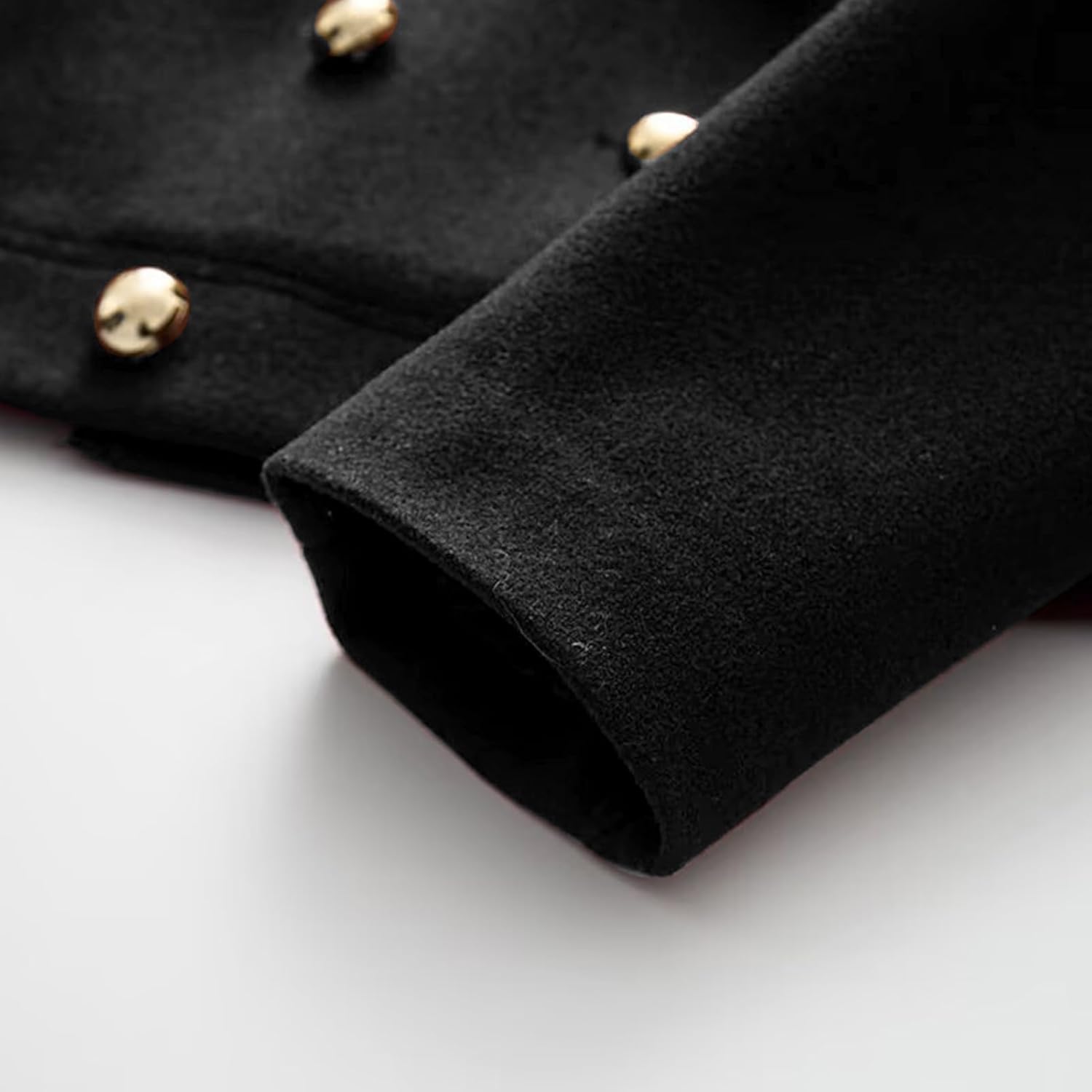 Close-up of the KEOMUD Elegant Peter Pan Coat Cuff and Gold Buttons