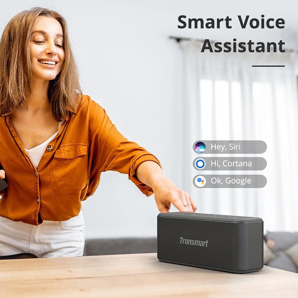 Woman interacting with the Tronsmart Mega Pro speaker to activate a smart voice assistant