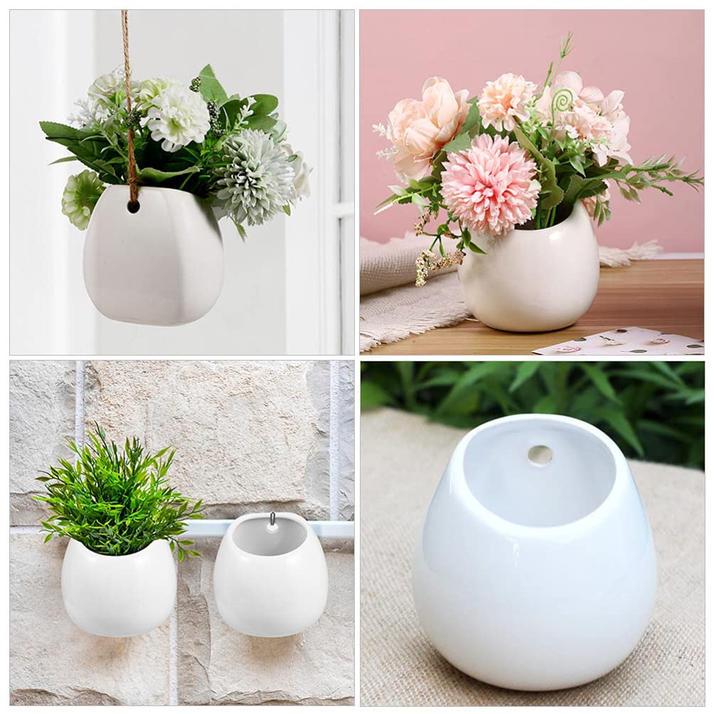 Białe ceramiczne doniczki ścienne, okrągłe wiszące uchwyty na rośliny, mini wazony ścienne do sukulentów, wewnętrzne donice cylindryczne, dekoracyjne dekoracje ścienne.