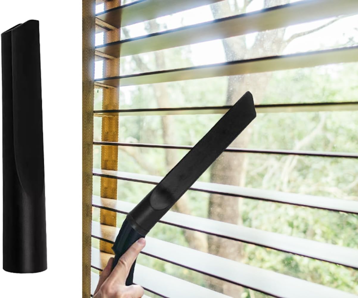 Crevice tool being used to clean dust from window blinds