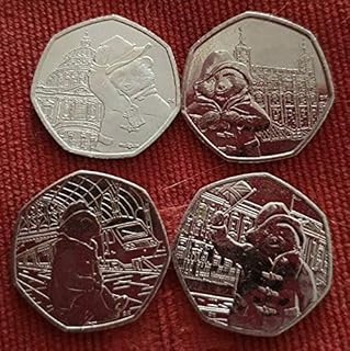 4 Paddington coins in sleeves. Uncirculated quality