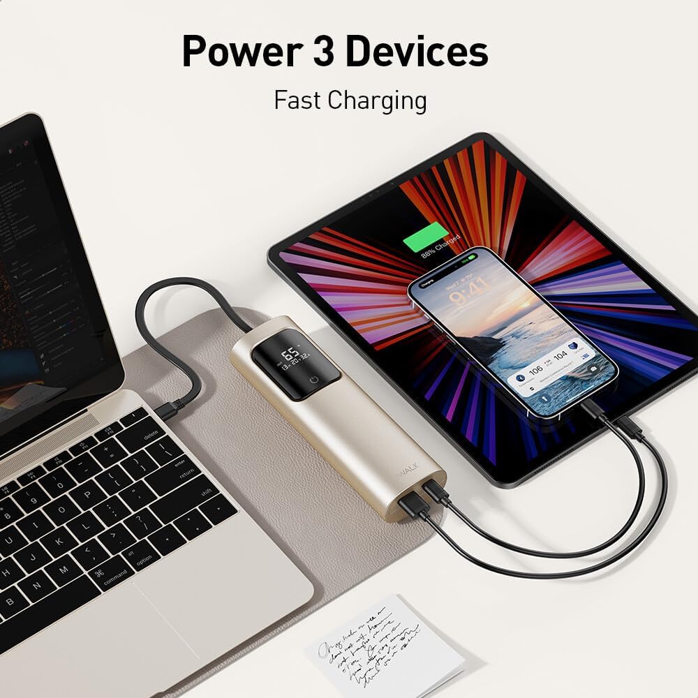 iWALK Power Bank charging a laptop, tablet, and smartphone simultaneously.