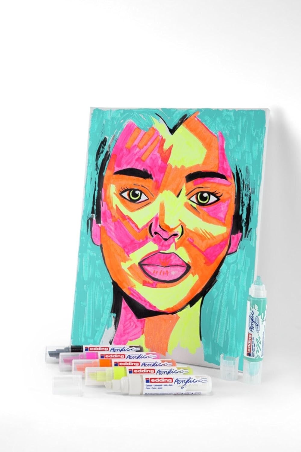 A vibrant pop art style portrait painted on canvas using edding acrylic markers, with several markers lying nearby.