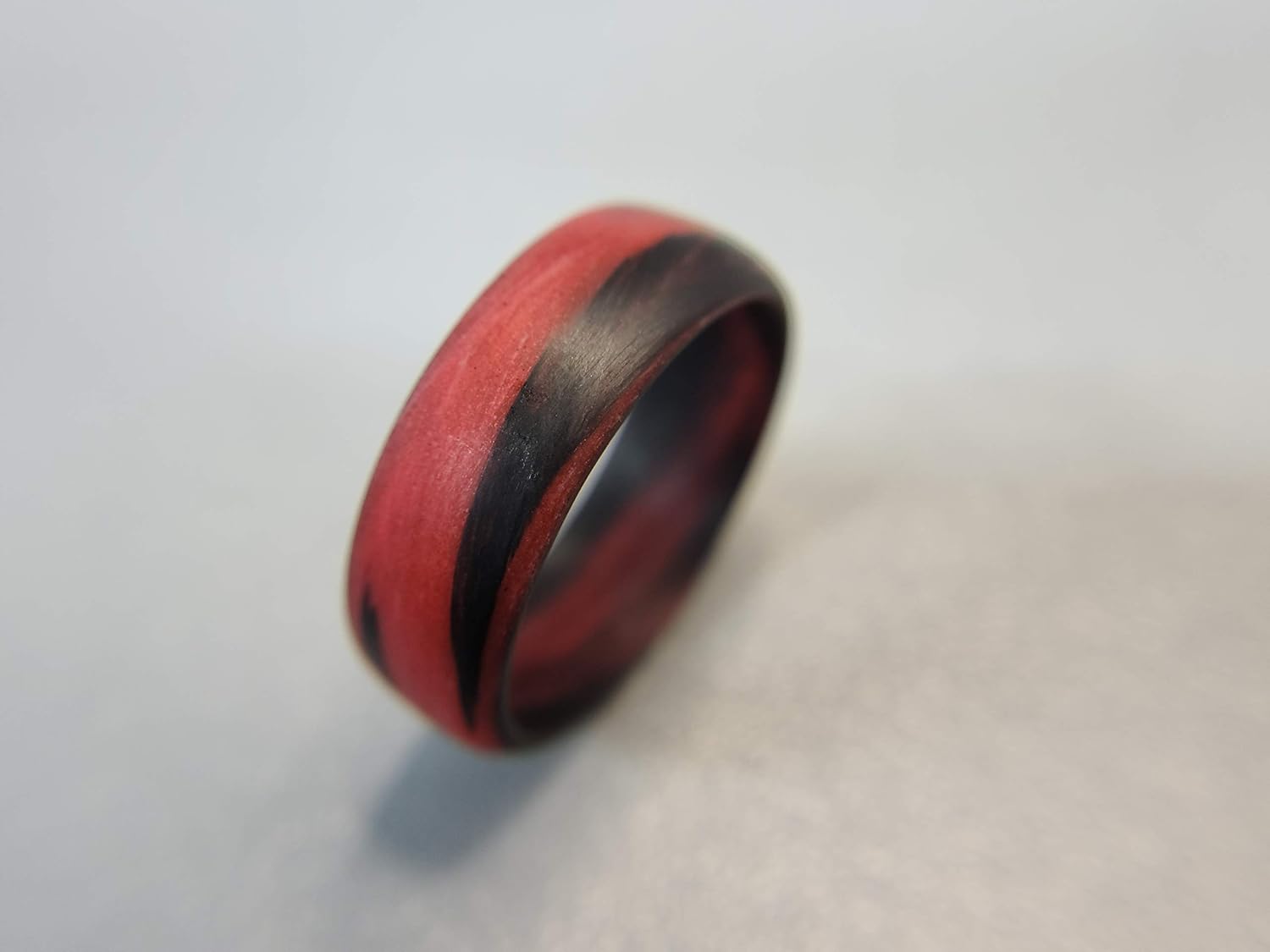 Carbon Fiber Red/Orange Marbled Glow Ring, Matte Finish, Glow-in-the-Dark, Durable, Waterproof, Sizes 4-16, Custom Bandwidths, Made in USA