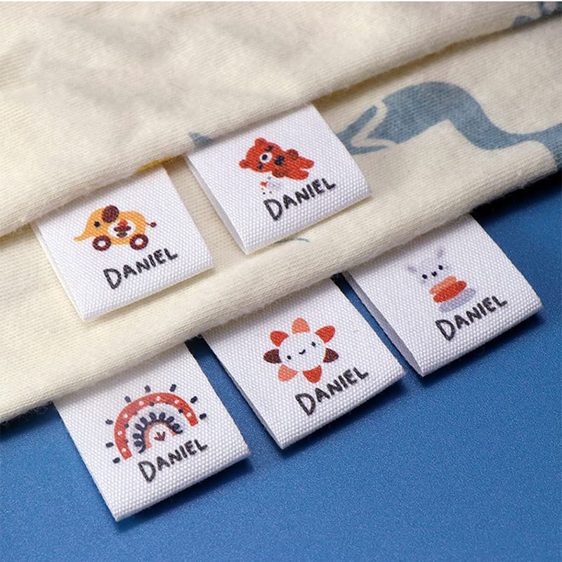 Dessins de logo sur étiquettes en tissu pour identification vêtement