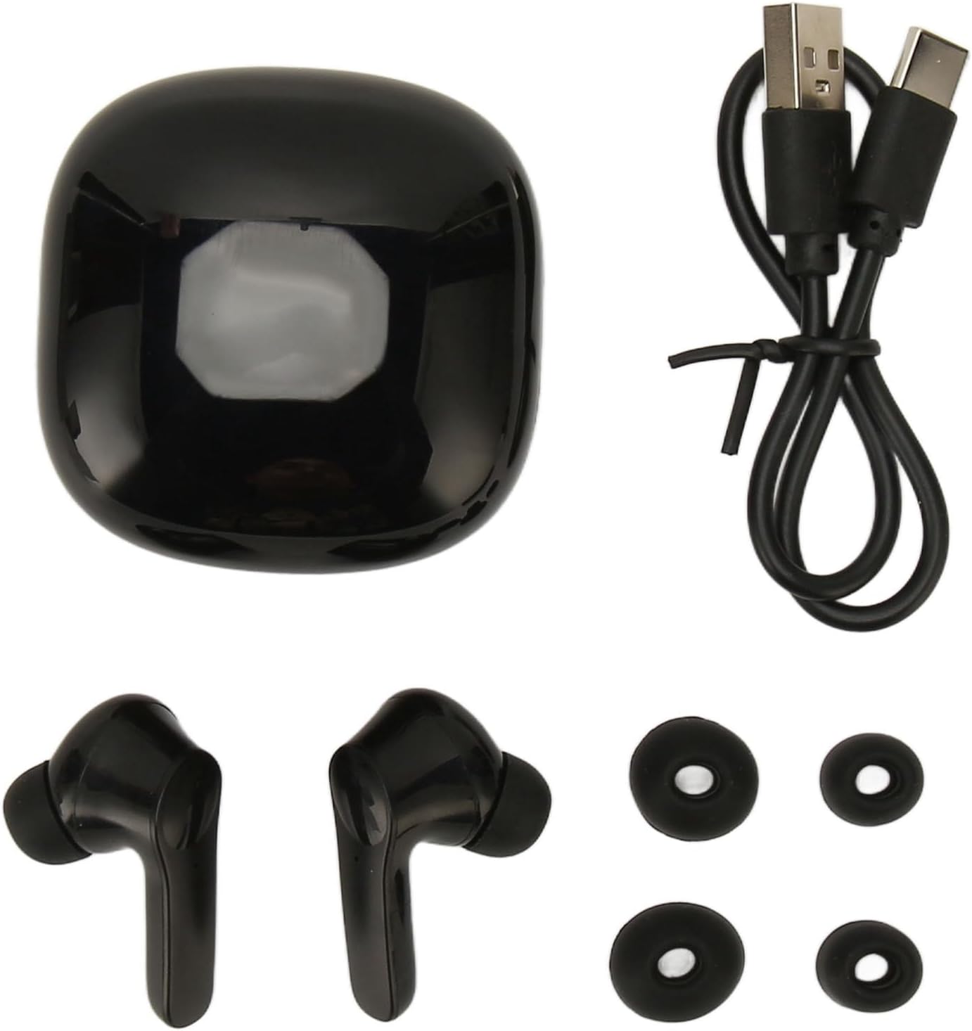 Image showing the flexman coreless Translator Earbuds package contents: two earbuds, a charging case, a charging cable, and two pairs of replacement earplugs.