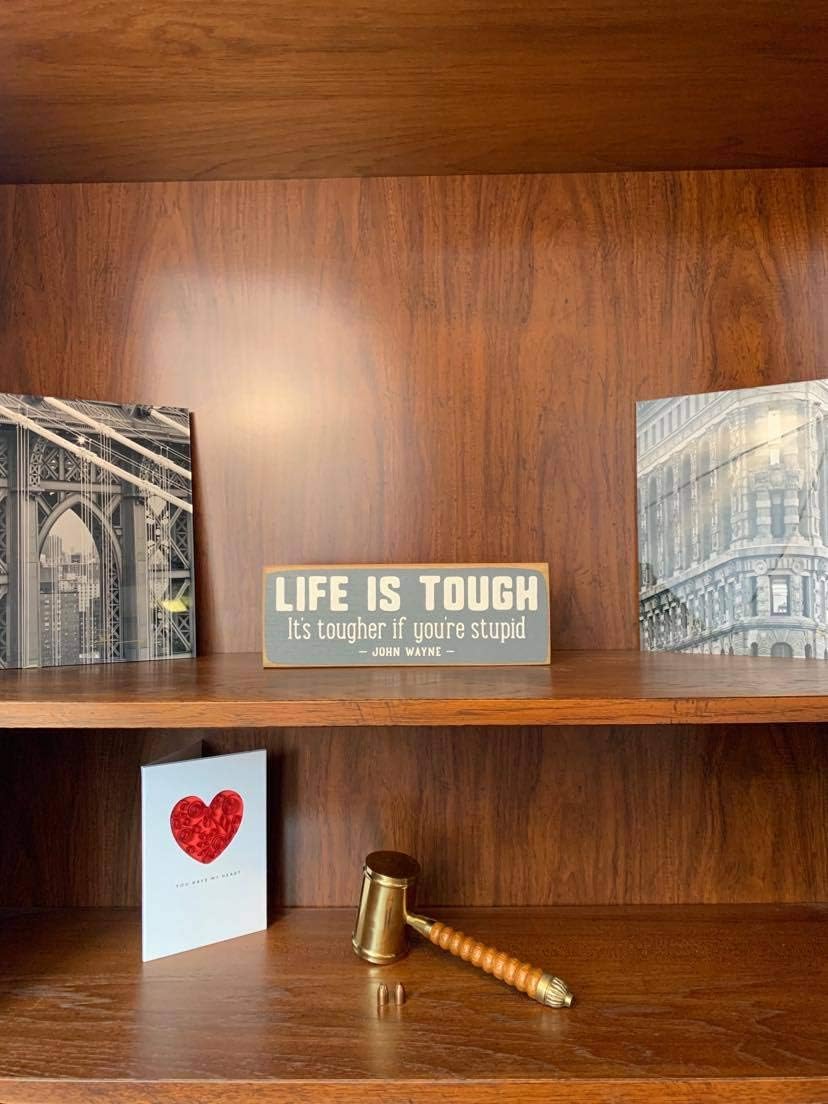 "Life Is Tough" Sawdust City Rustic Wooden Sign - Made From Solid Knotty Pine & Distressed Wood - White Stenciled Lettering Wall Art Room Decor On Slate Grey Background 10x3.5 : Home & Kitchen