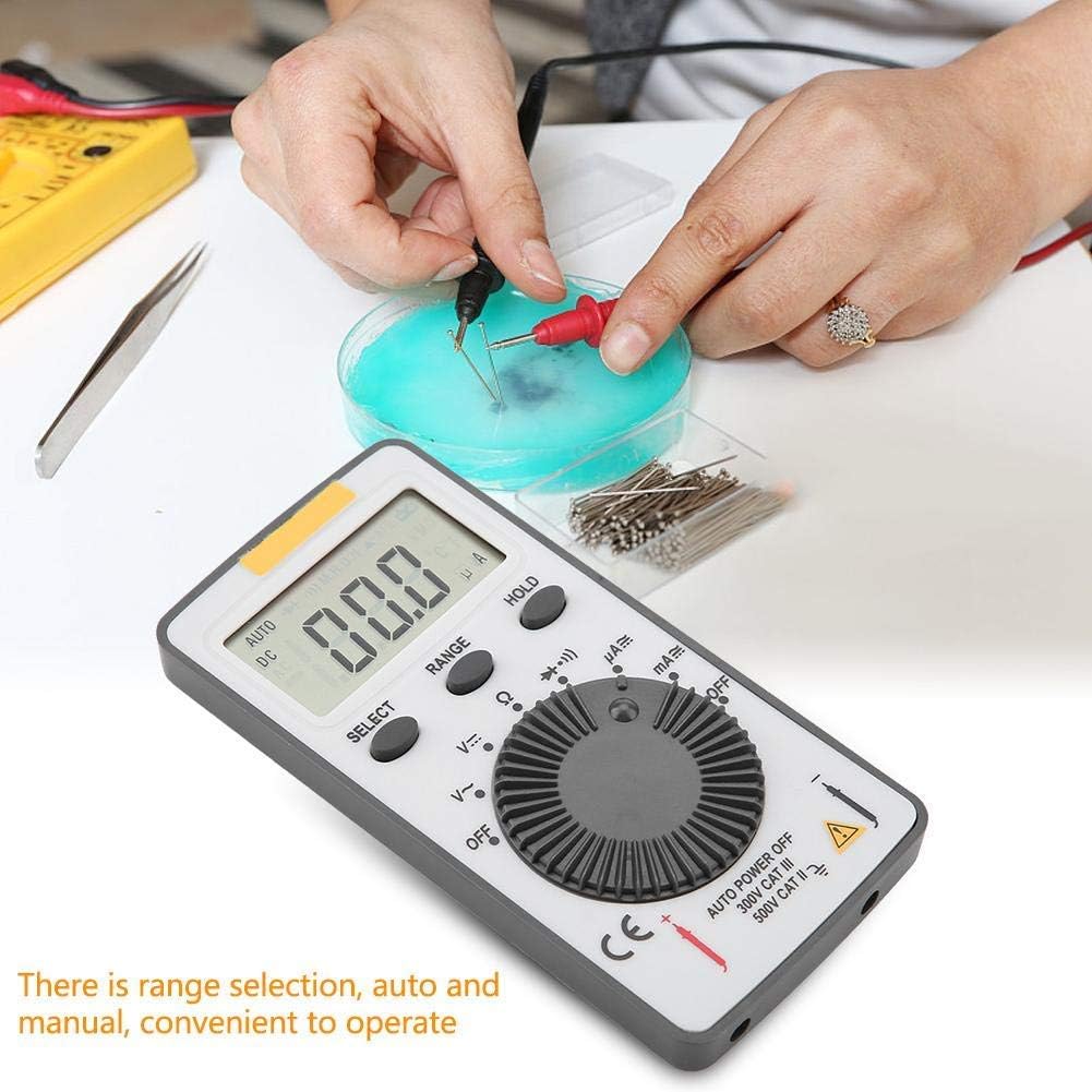 Person using the ANENG AN101 Digital Multimeter to measure a component.