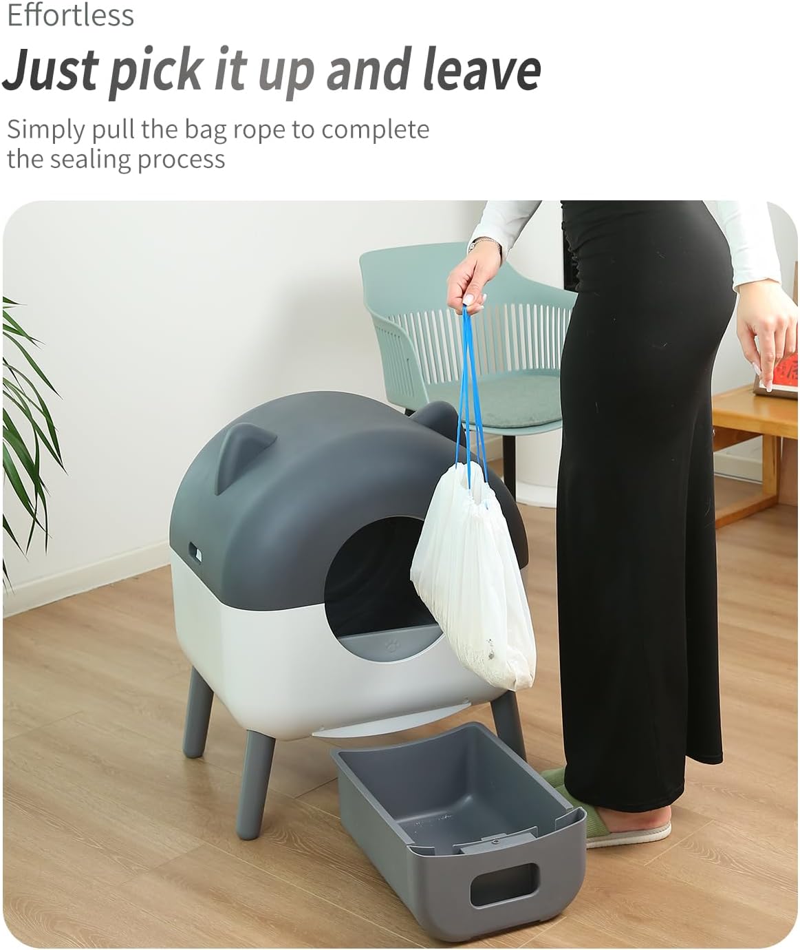 Person pulling a sealed waste bag from the litter box waste drawer