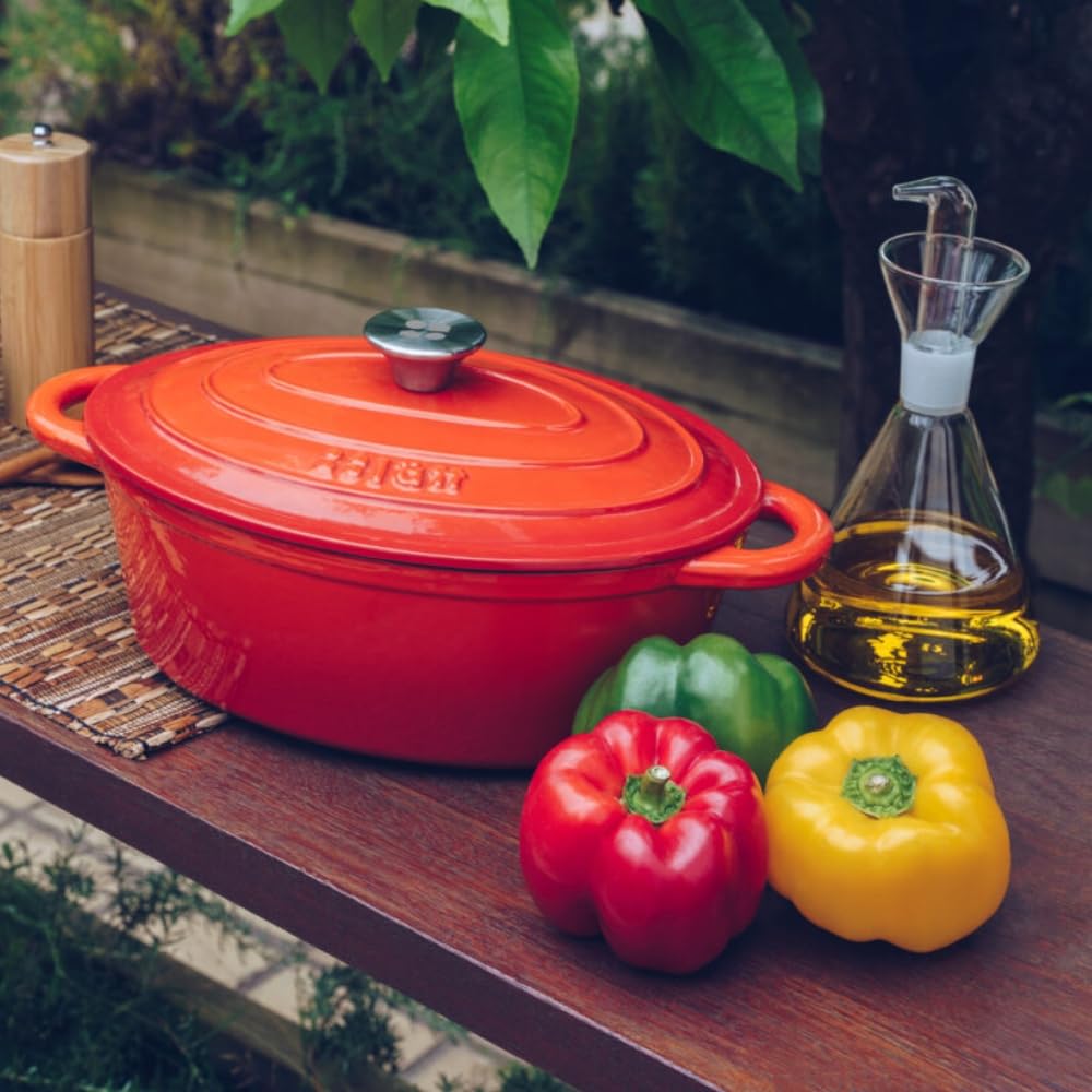 Cocotte in Ghisa Smaltata Arancione. Forno Olandese Pentola Ovale Antiaderente 29x21x11 CM - 3,85 L. Casseruola Pentola in Ferro per Induzione, Vetroceramica e Forno