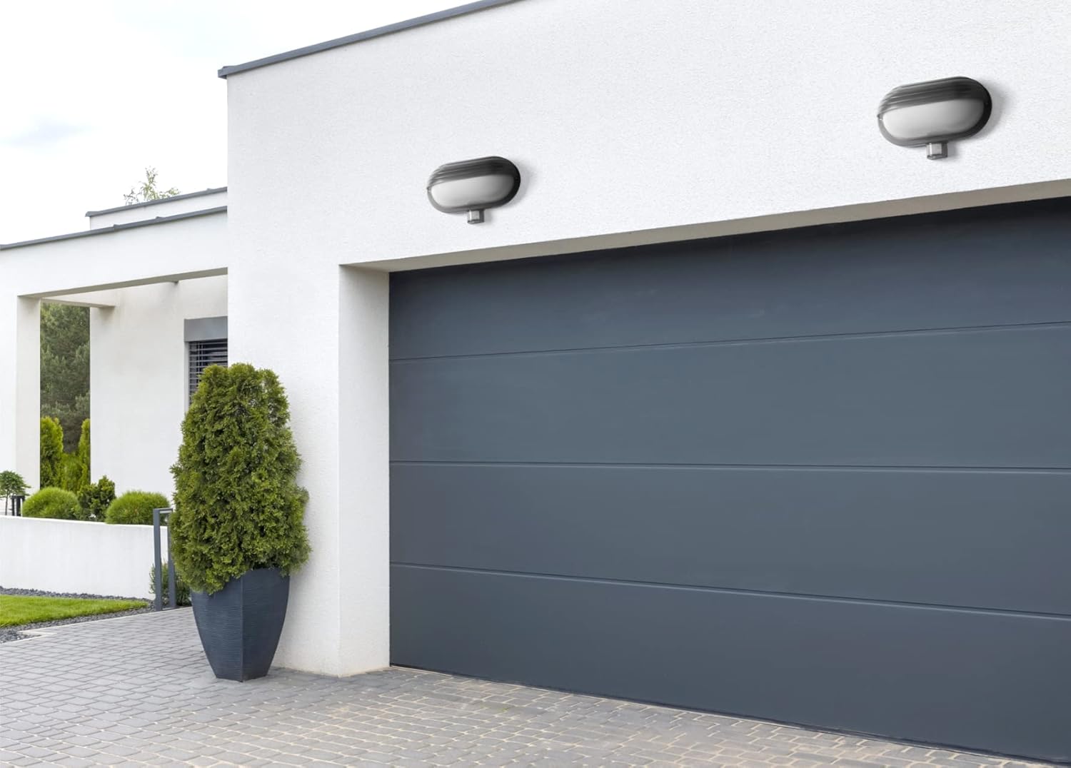 Two Virone MUSAM E27 lamps installed above a garage door