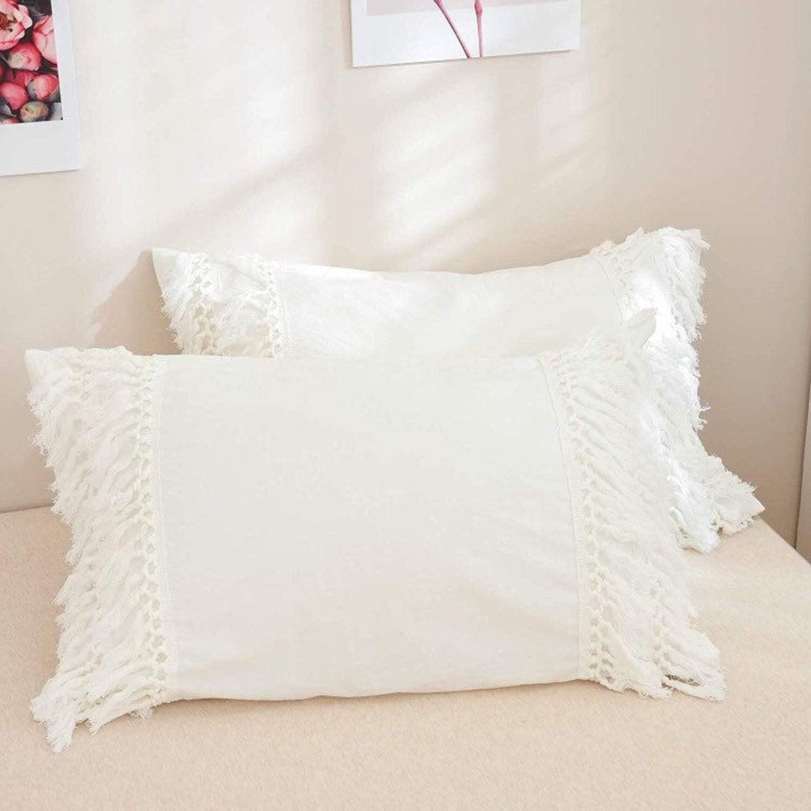 Set di 2 federe per cuscino con frange e pompon UO (nappe color avorio, 50 x 66 cm)