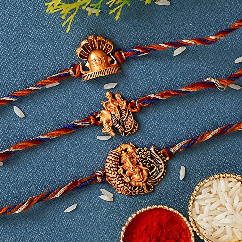 Image of eCraftIndia Set of 3 Rakhi Combo Hamper | Om Krishna Peacock Feather Lord Ganesha Silver Religious Designer Rakhis | Roli Chawal Pack
