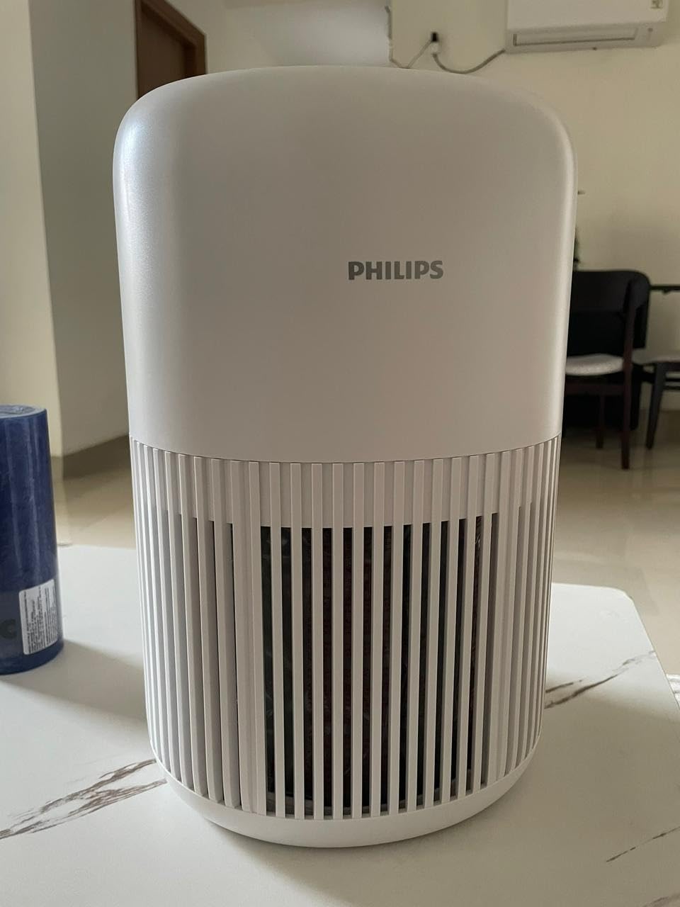 Philips AC0920 air purifier placed in a bedroom
